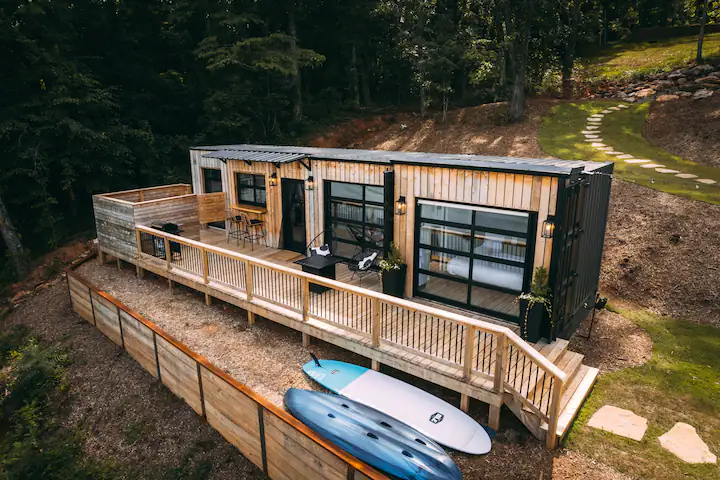 A shipping container home with four garage doors!!