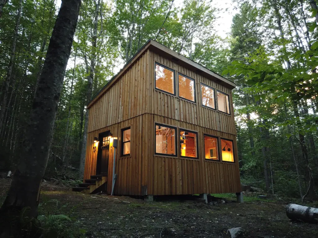 A tiny house built by hand in the middle of the forest