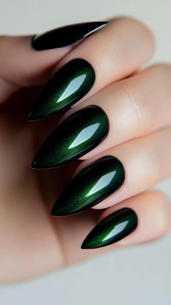 Close-up of medium-length round nails painted with a glossy, opaque beige nude polish.