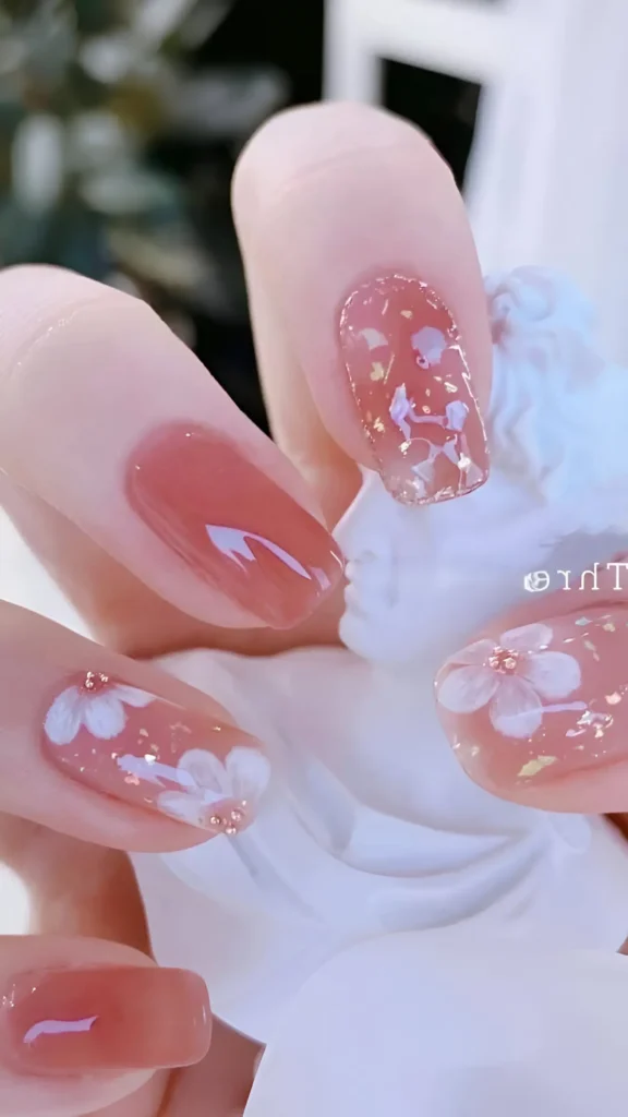 Cute nail design featuring solid bright rainbow colors (yellow, orange, pink, purple, blue, green), each outlined with a thin white border; square/squoval shape.